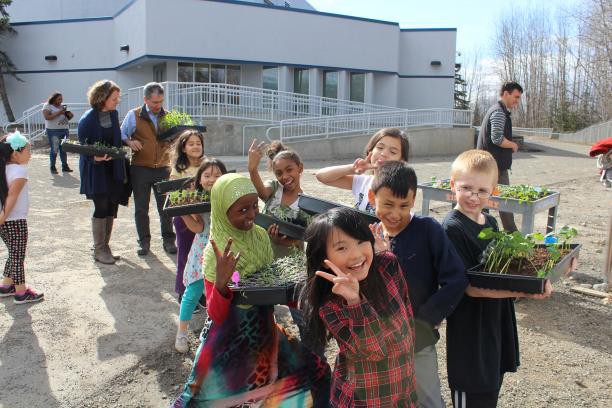 Children show off their plants with Mayor Ethan Berkowitz at Mountain View Elementary School in Anchorage, United States on 26 April 2017. Photo Credit: Katherine Kemp
